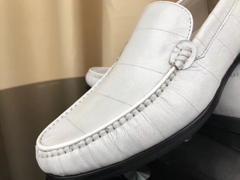 White men's loafers made of soft eel skin leather by Rossie Viren, showcasing sleek slip-on shoes with smooth leather finish.