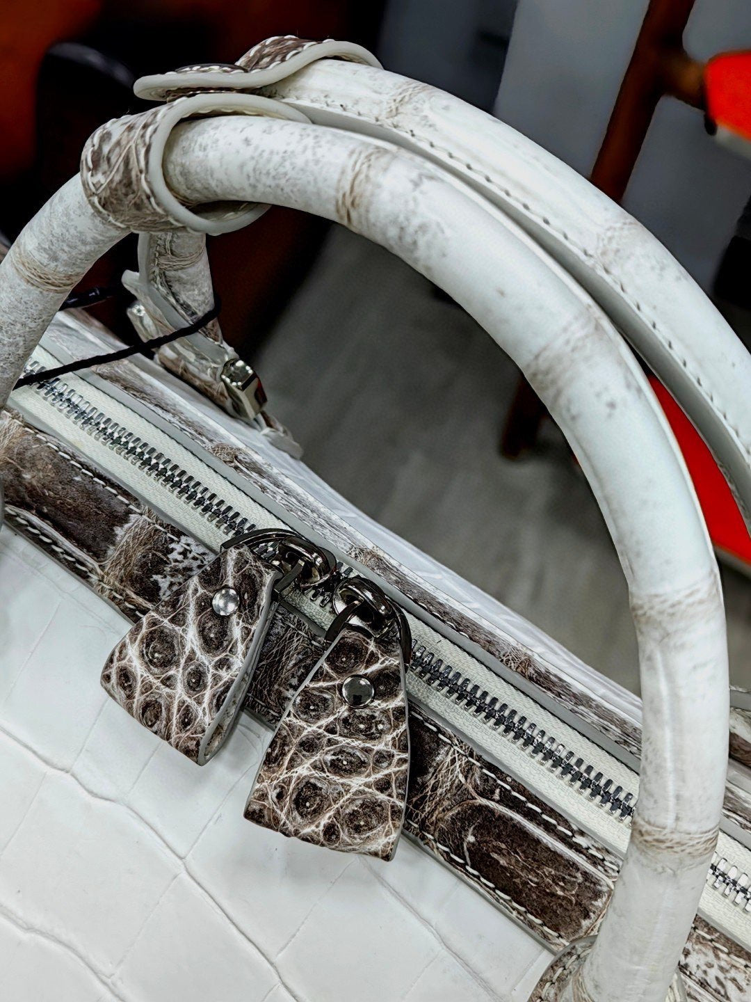 Unisex Himalayan genuine crocodile leather travel duffel bag with sturdy handles, spacious design, and stylish craftsmanship.