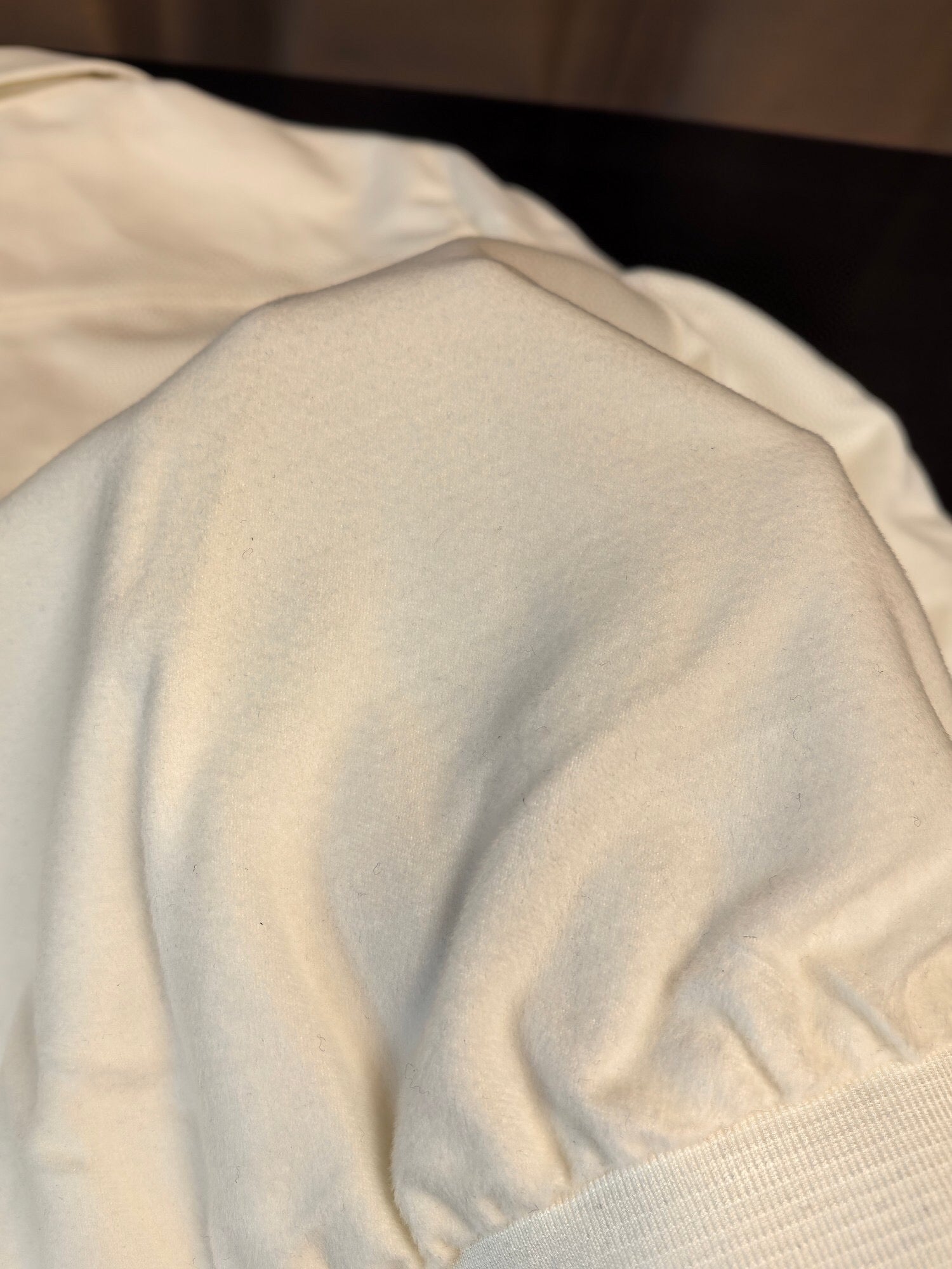 Himalaya white crocodile leather jacket by Rossie Viren featuring wool accents, showcasing luxurious textured crocodile skin.