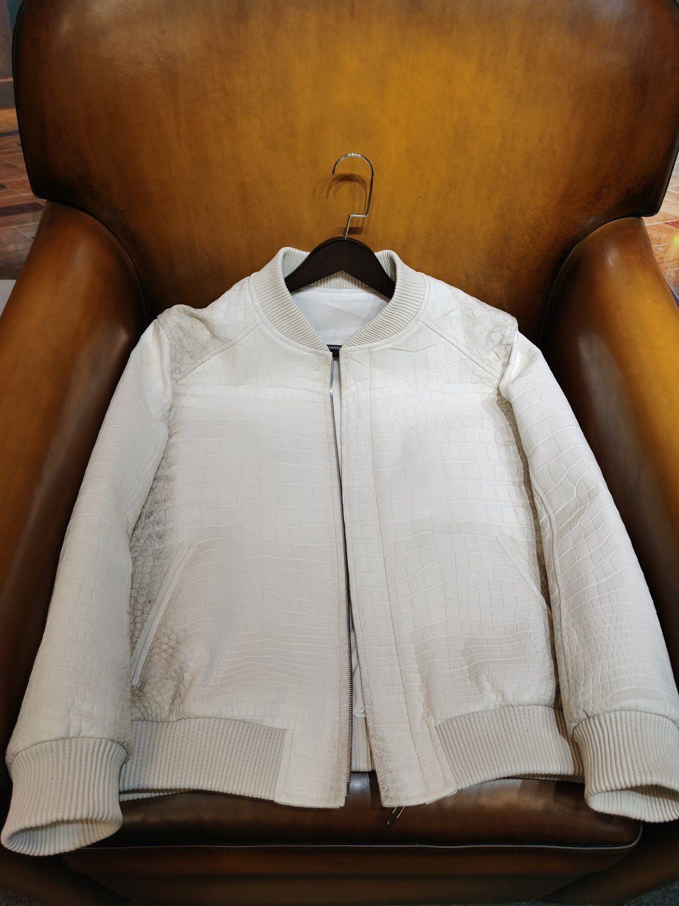 Himalaya white crocodile leather jacket by Rossie Viren with wool lining, showcasing luxurious textured crocodile skin and stylish design.