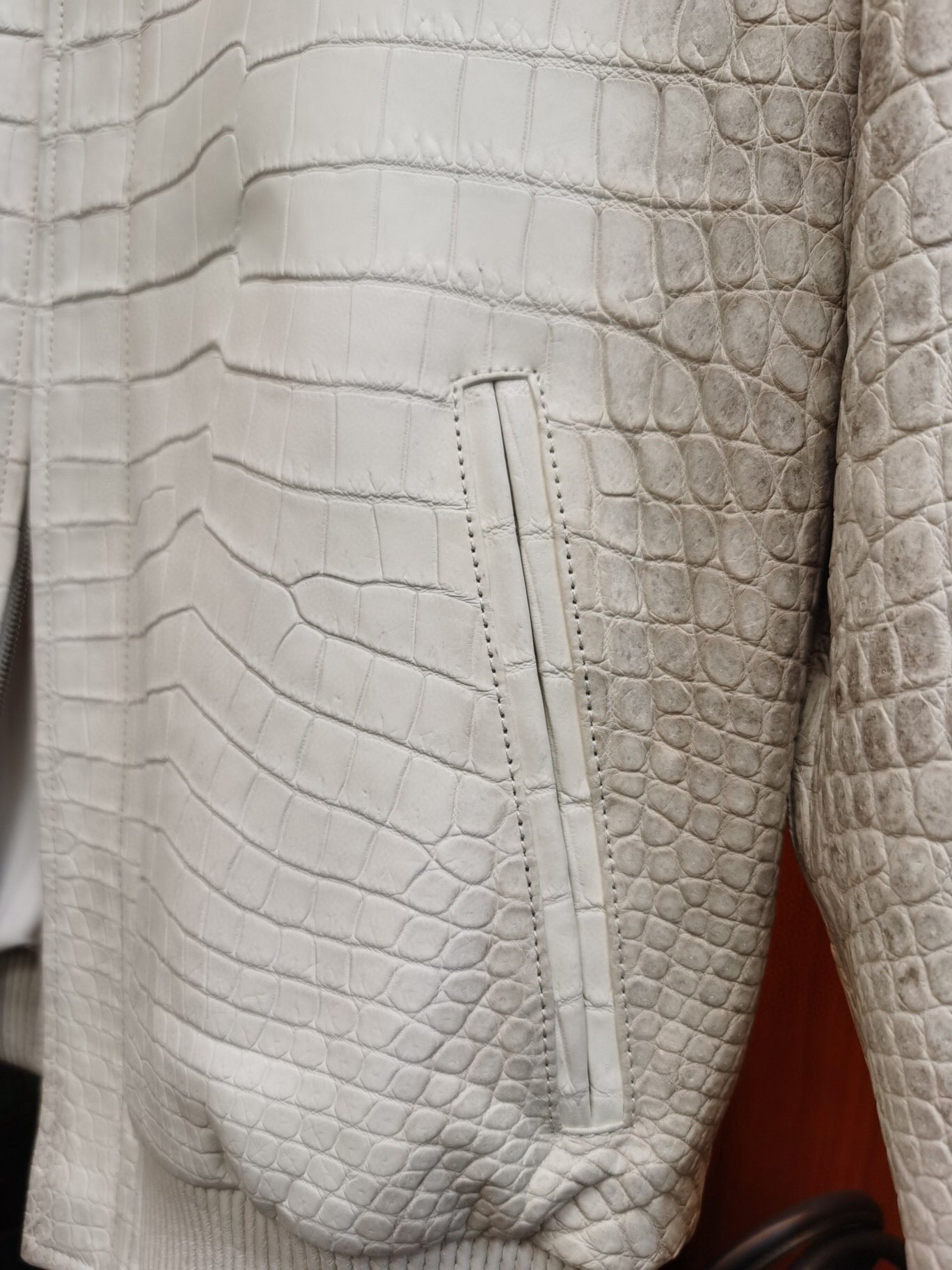 Himalaya white crocodile leather zip-up jacket by Rossie Viren, featuring textured crocodile skin and a sleek, stylish design.