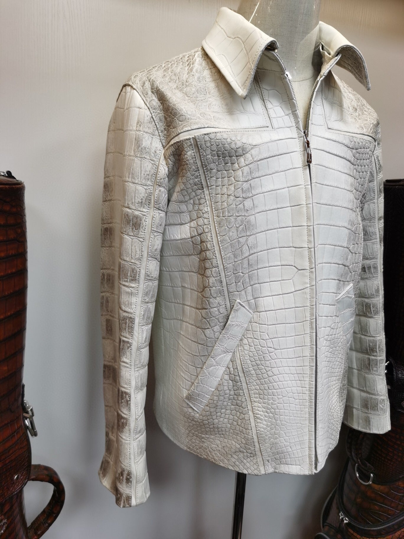 Himalaya white crocodile leather zip-up jacket by Rossie Viren, stylish and luxurious with textured crocodile pattern.