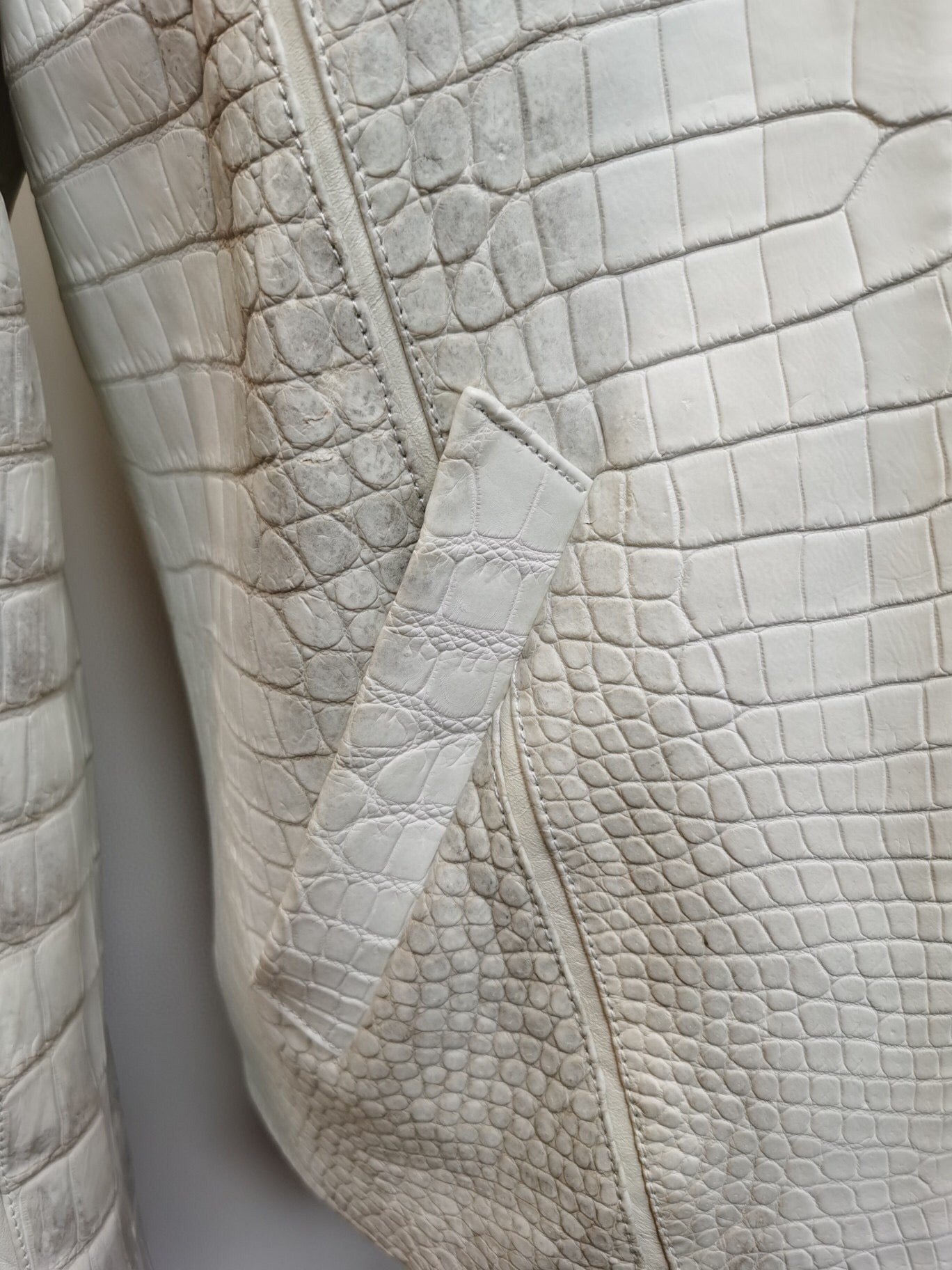 Himalaya white crocodile leather jacket with zip-up front by Rossie Viren, featuring a luxurious textured crocodile skin design.