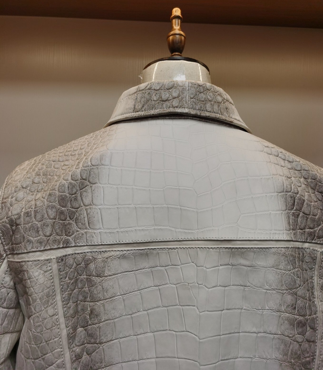 Himalaya white crocodile leather jacket by Rossie Viren featuring a zip-up front and luxurious crocodile skin texture.