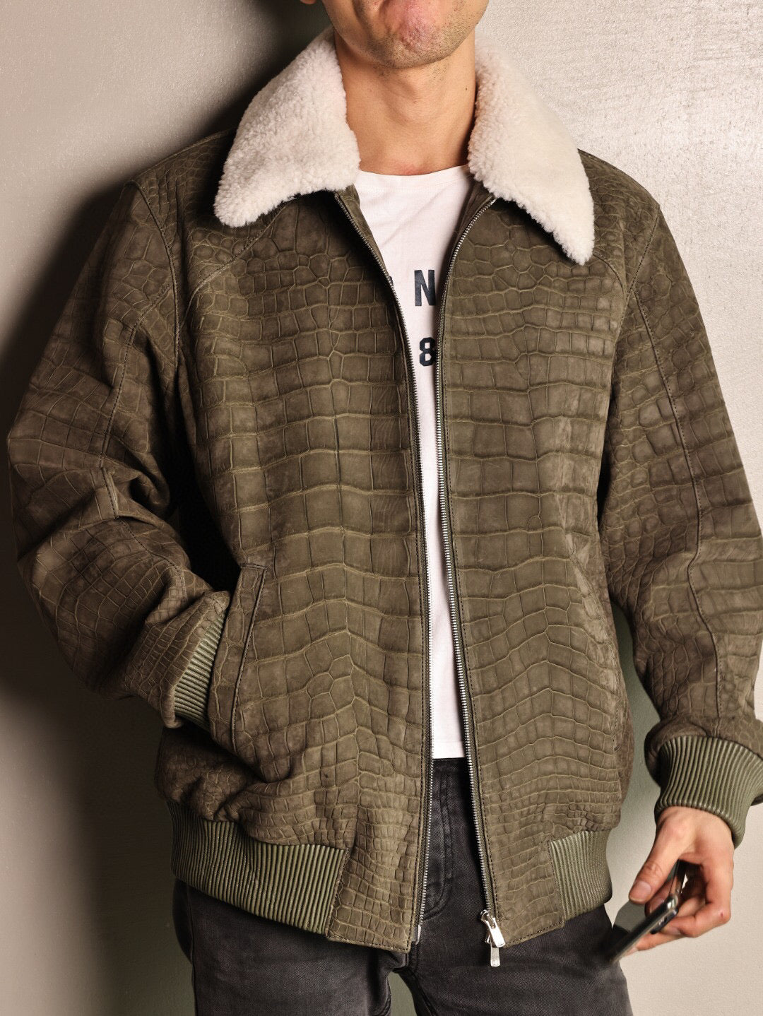 Green crocodile leather jacket with wool collar, zip-up casual coat by Rossie Viren, featuring a stylish rat tail design.