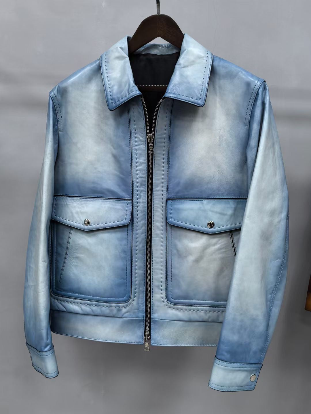 Vintage blue men's leather jacket by Rossie Viren, stylish and classic, featuring a fitted leather design and detailed stitching.