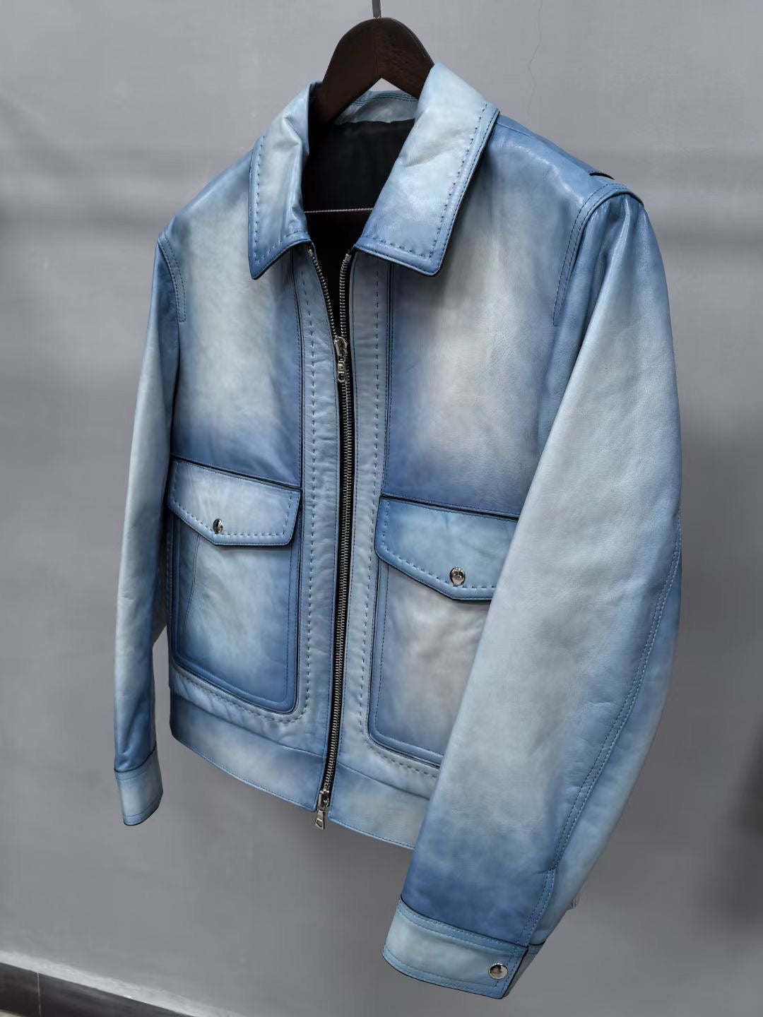 Vintage blue leather men's jacket by Rossie Viren, stylish leather jacket with classic design and detailed stitching.
