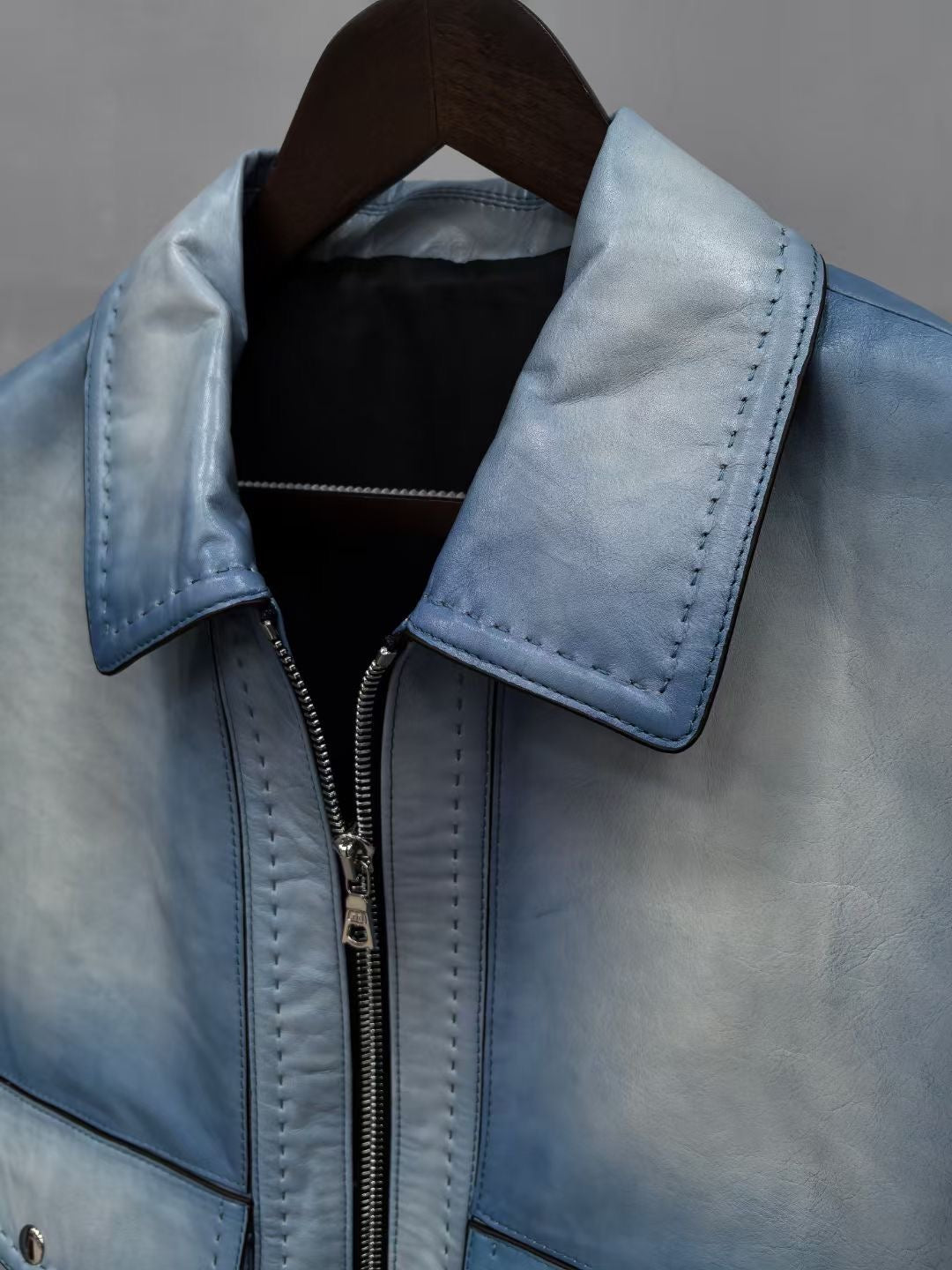 Vintage blue leather men's jacket by Rossie Viren, stylish leather jacket with classic design and detailed stitching.
