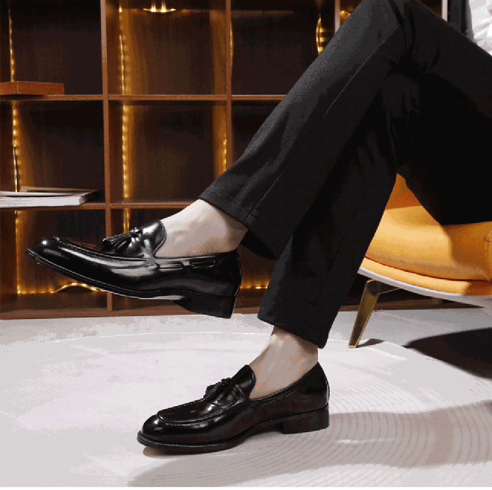 Genuine Shell Cordovan leather loafers with tassels by Rossie Viren, showcasing polished dark brown shoe details.