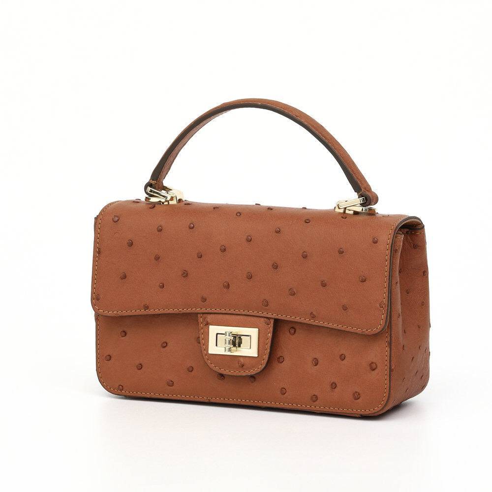 Women's Rossie Viren ostrich leather mini flap chain bag with top handle and crossbody strap, showing the bag's elegant design and texture.