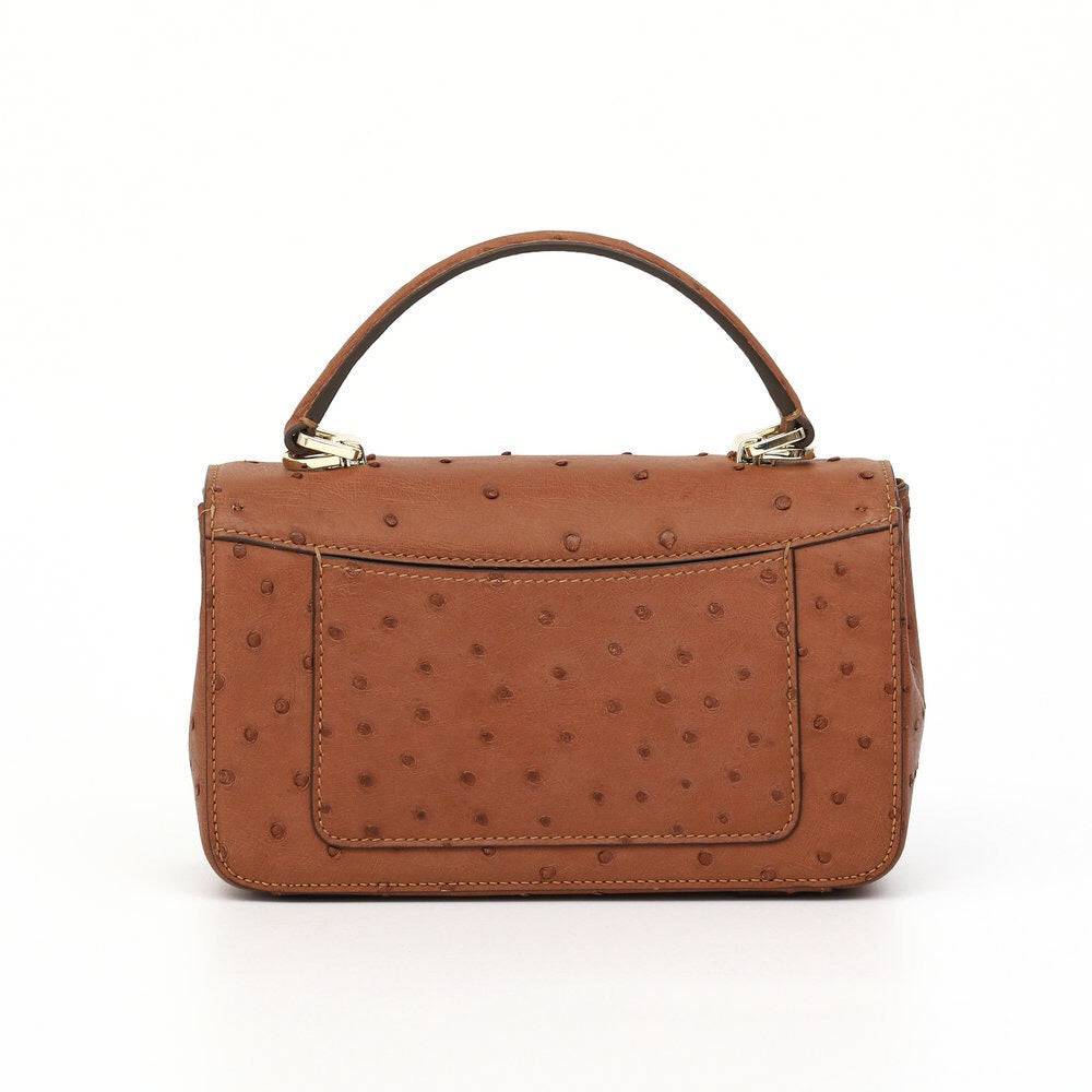 Women’s ostrich leather mini flap chain bag with top handle and crossbody strap by Rossie Viren, showing front view and chain detail.