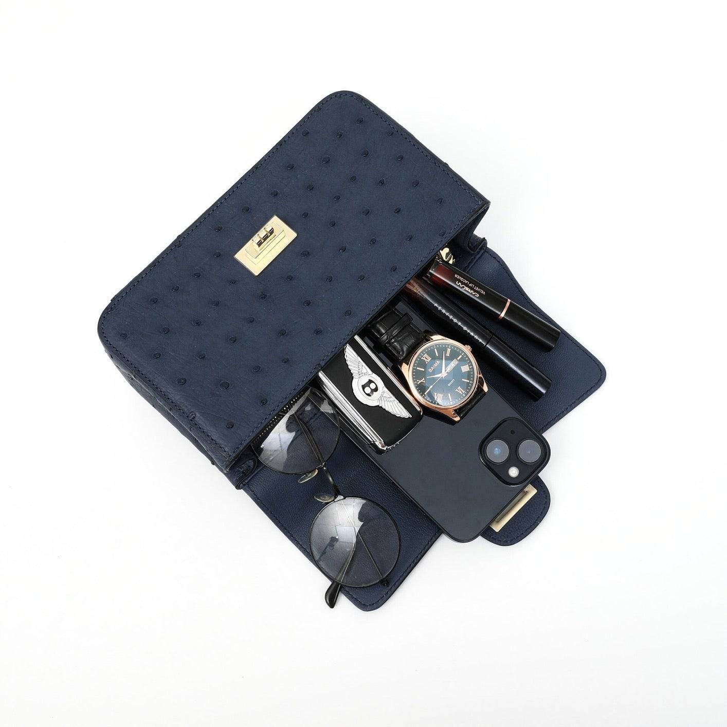 Rossie Viren women's ostrich leather mini flap chain handbag with top handle and crossbody strap, showcasing its elegant design and texture.