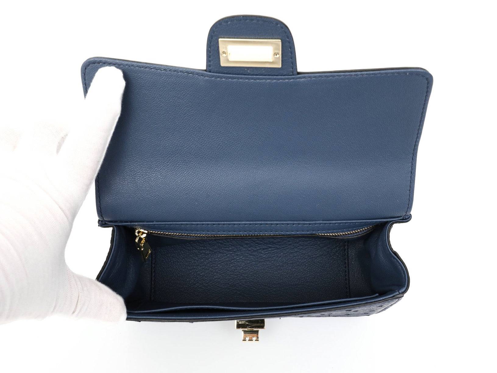 Rossie Viren women's ostrich leather mini flap chain bag with top handle and crossbody strap, showcasing elegant handbag design.
