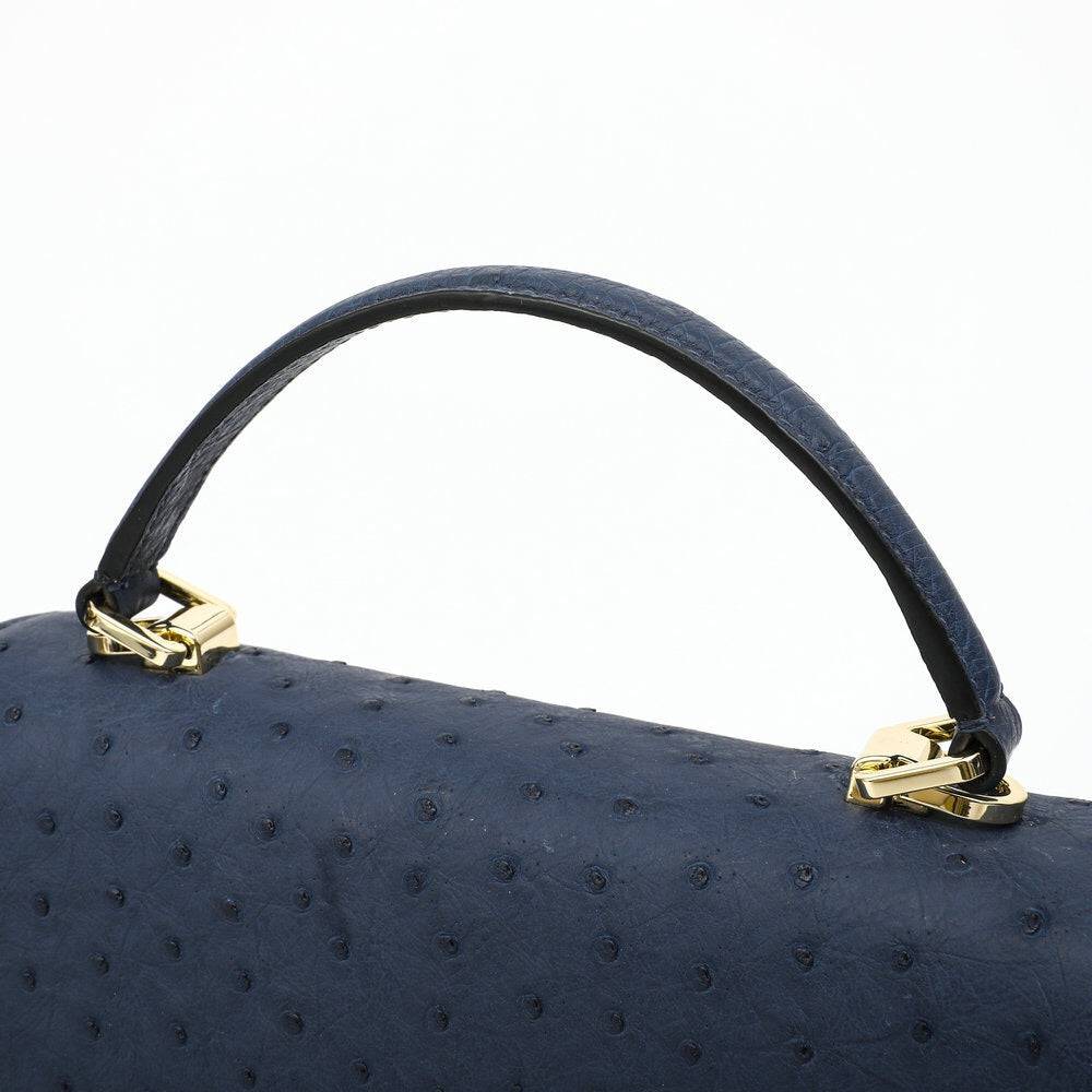 Women's Rossie Viren ostrich leather mini flap chain handbag with top handle and crossbody strap, featuring a stylish design.