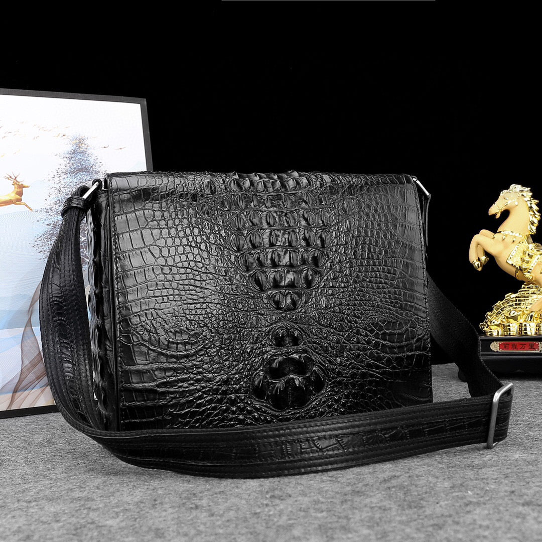 Genuine crocodile leather postal messenger handbag by Rossie Viren with adjustable strap and classic design.