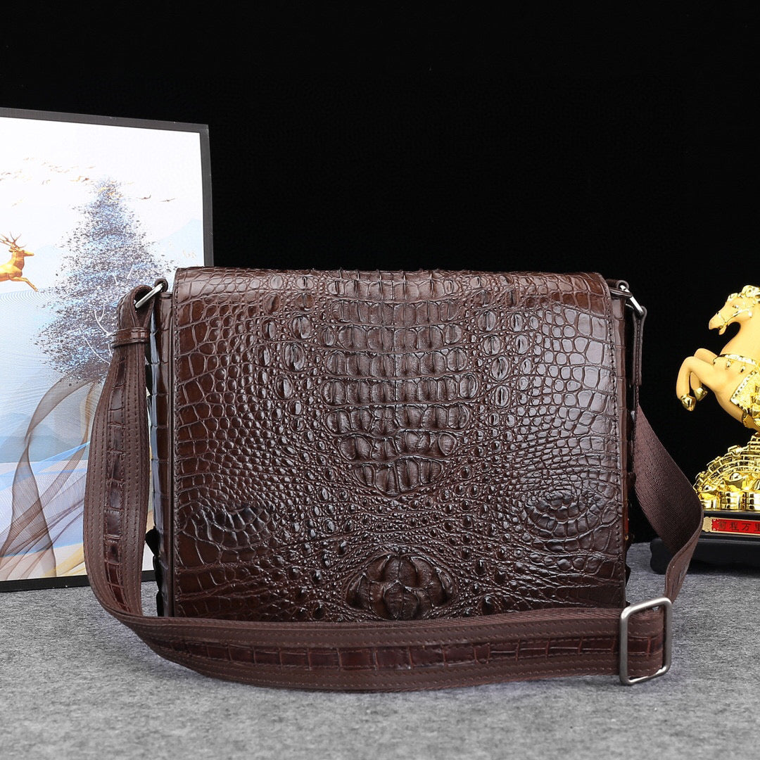 Genuine crocodile leather postal messenger bag by Rossie Viren, stylish handbag with textured crocodile pattern and adjustable strap.