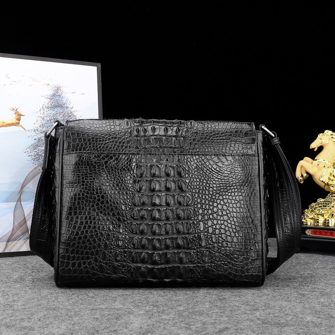 Genuine crocodile leather postal messenger handbag by Rossie Viren featuring a sleek, structured design and adjustable shoulder strap.