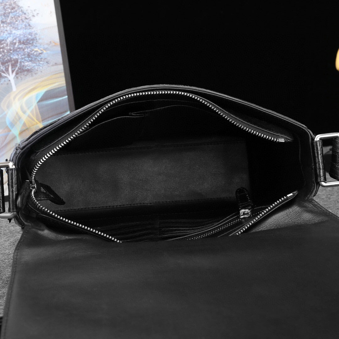 Genuine crocodile leather postal messenger handbag by Rossie Viren with adjustable strap and sleek design.