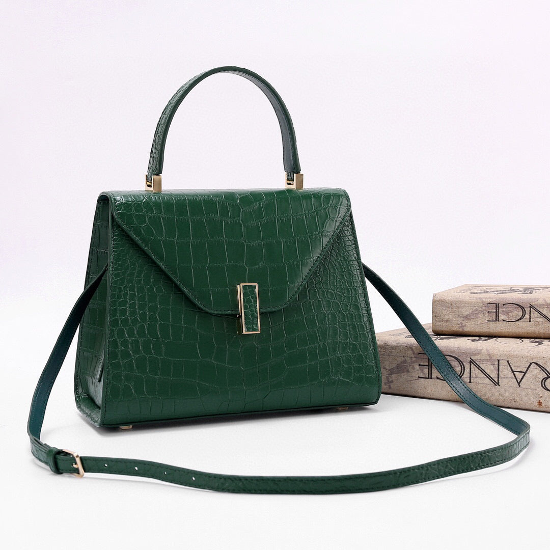 Dark green genuine crocodile skin leather top handle bag by Rossie Viren, featuring a sleek, luxurious design with sturdy handles.