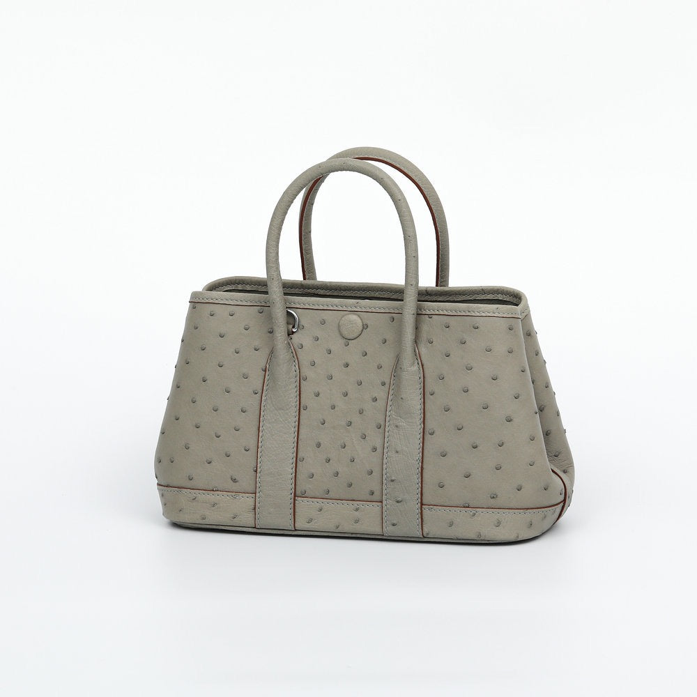 Genuine ostrich skin leather small tote handbag by Rossie Viren, featuring textured black leather and top handles.