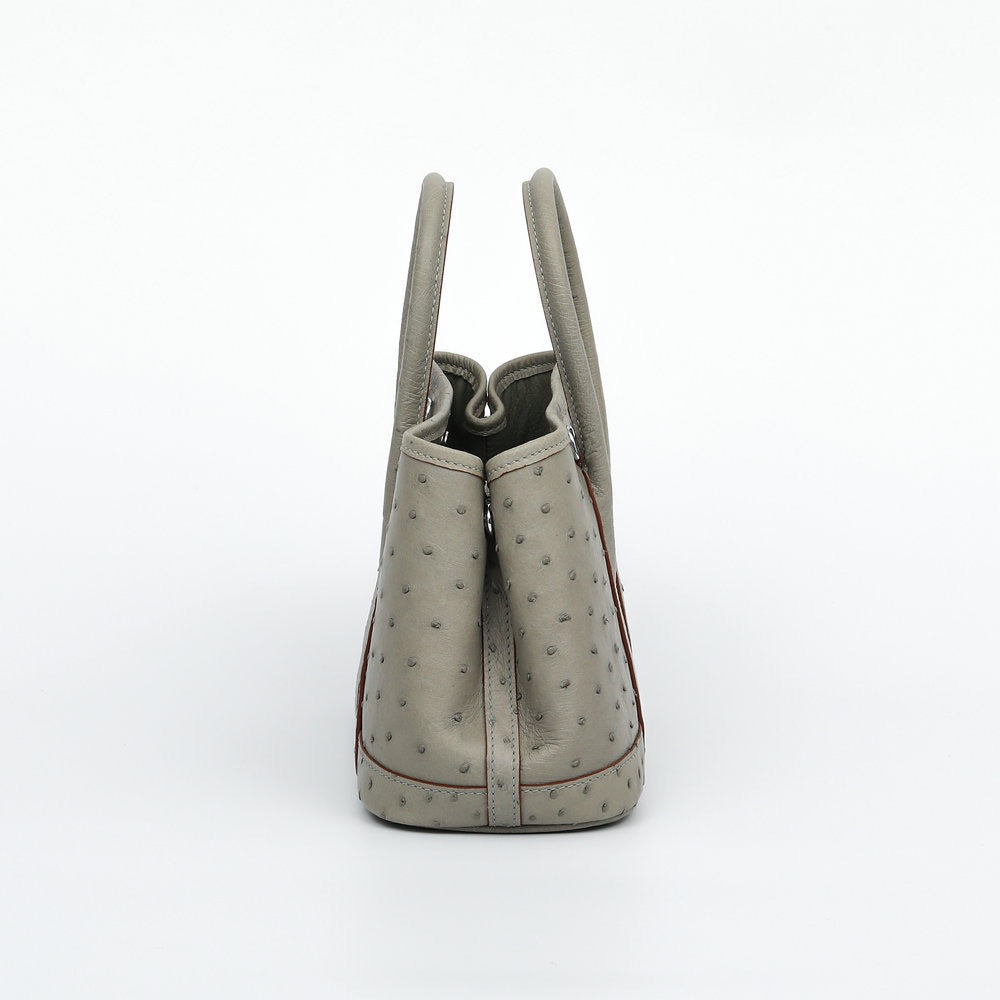 Genuine ostrich skin leather small tote bag by Rossie Viren, featuring a sleek handbag design with textured ostrich pattern.