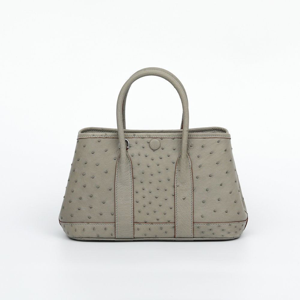 Genuine ostrich skin leather small tote bag by Rossie Viren, featuring textured surface and sturdy handles for stylish carrying.