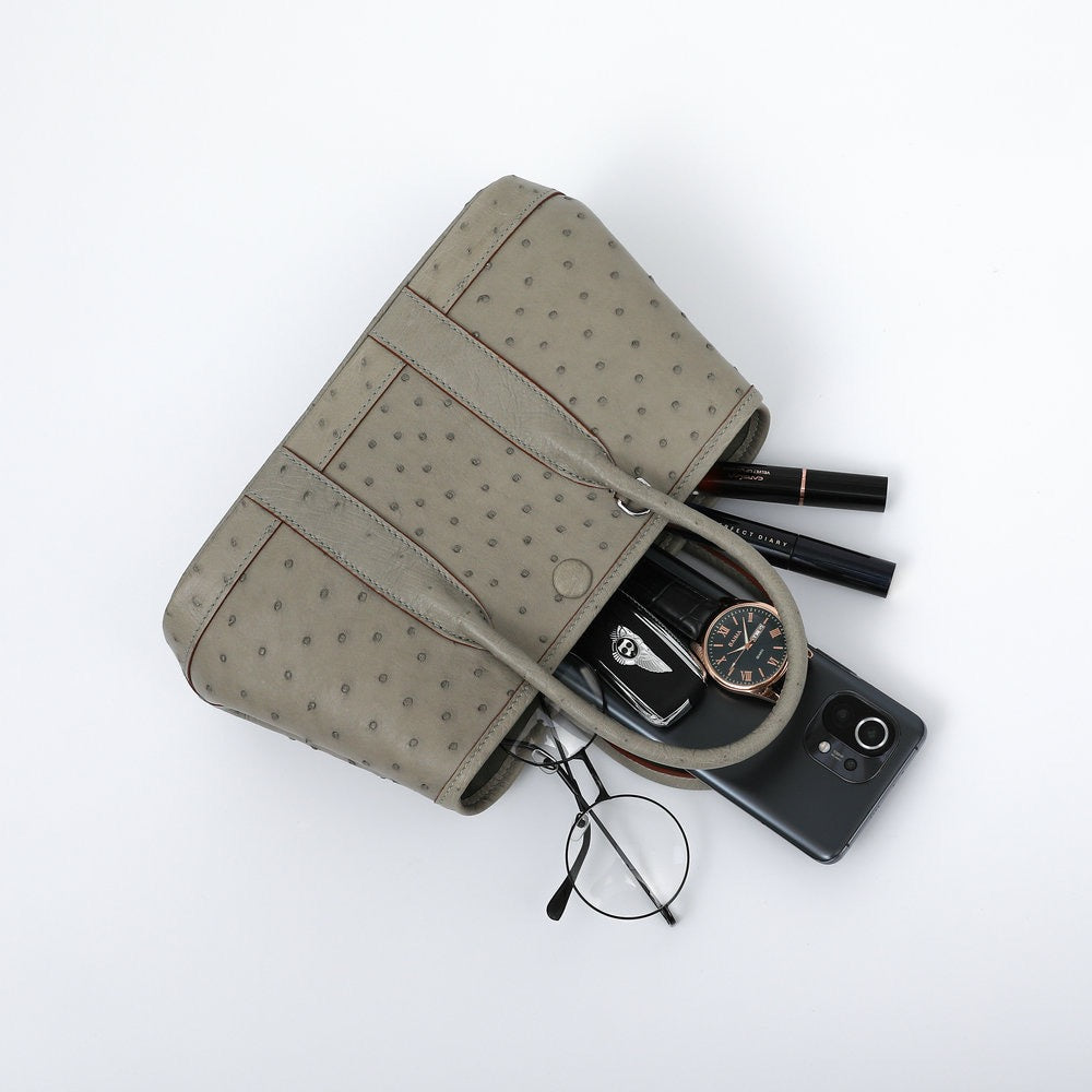 Genuine ostrich skin leather small tote handbag by Rossie Viren, featuring textured surface and sturdy handles.