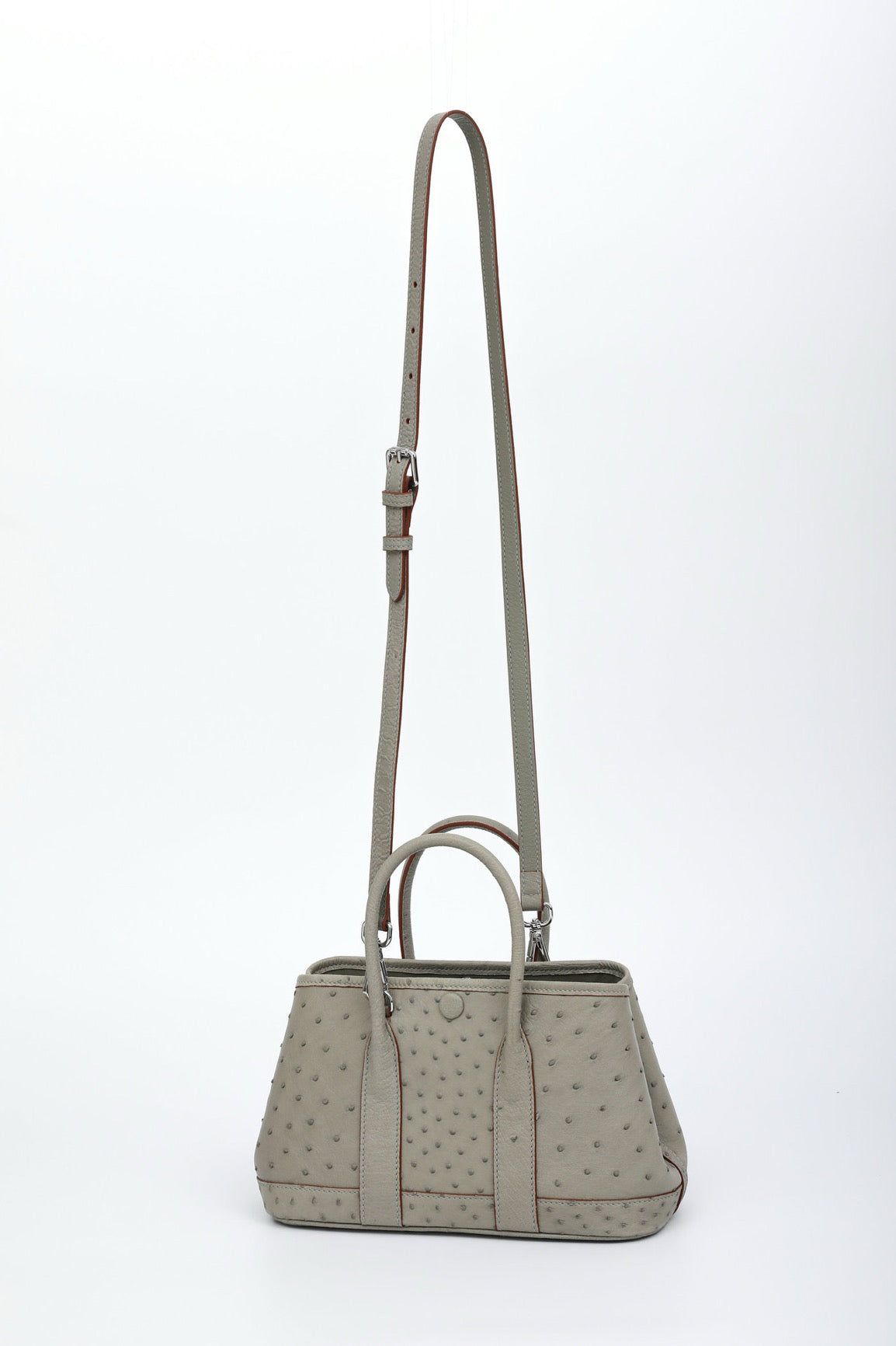Genuine ostrich skin leather small tote bag by Rossie Viren, stylish handbag with textured surface and sturdy handles.