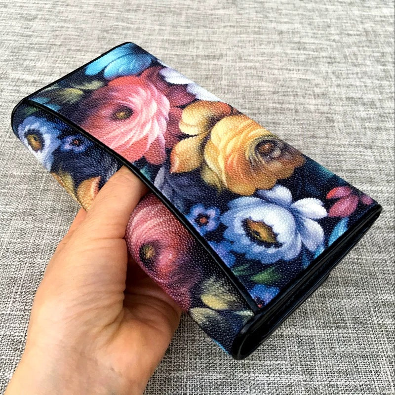 Genuine stingray tri-fold wallet with floral design for women by Rossie Viren, showing textured stingray leather and floral accents.