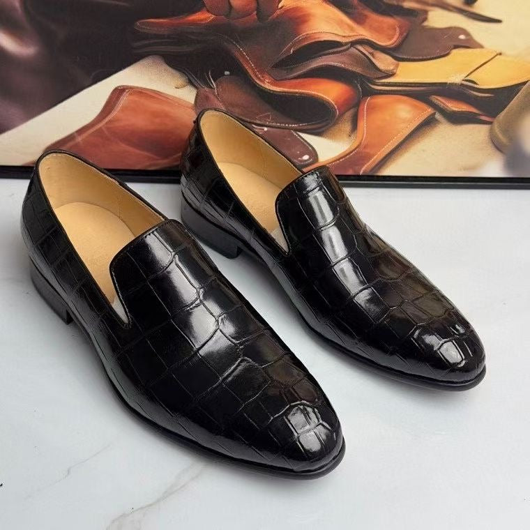Black genuine crocodile leather slip-on loafers by Rossie Viren, showcasing luxurious textured crocodile pattern and sleek design.