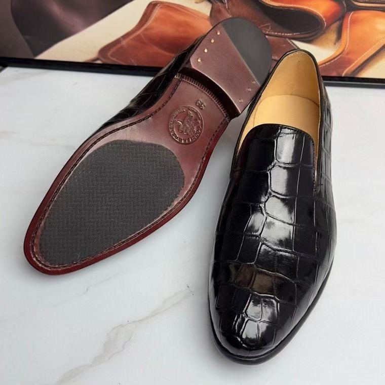Black genuine crocodile leather slip-on loafers by Rossie Viren, showcasing the textured crocodile pattern and sleek design.