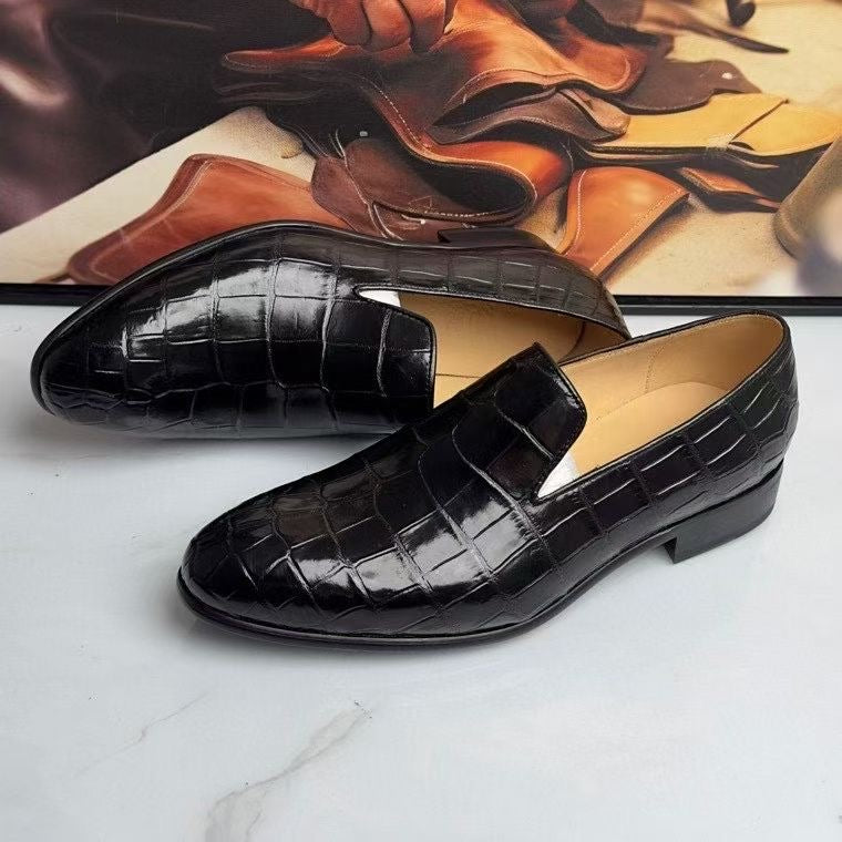 Black genuine crocodile leather slip-on loafers by Rossie Viren, showcasing sleek, textured crocodile pattern and classic loafer style.