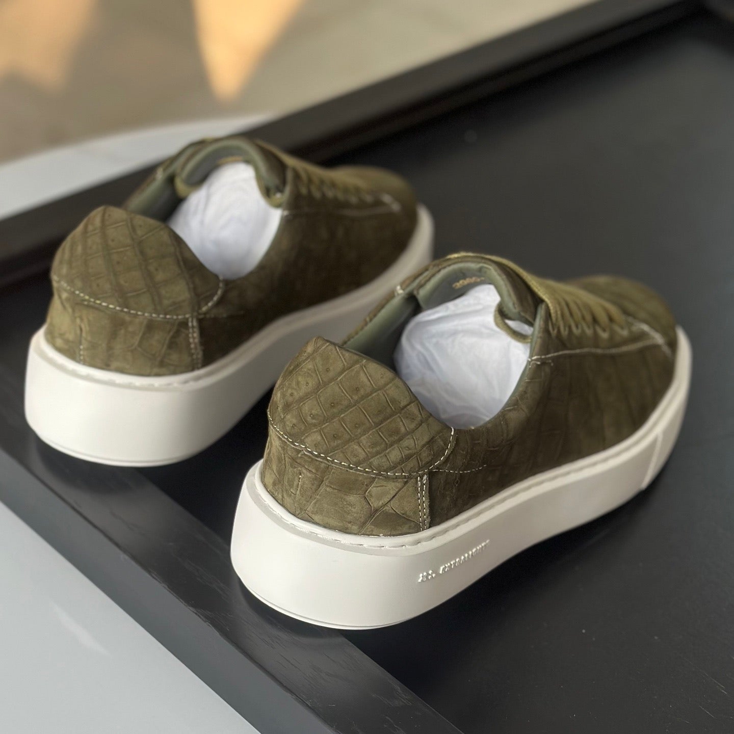 Green Rossie Viren crocodile sneakers made from genuine nubuck crocodile leather, showcasing stylish and luxurious shoes.