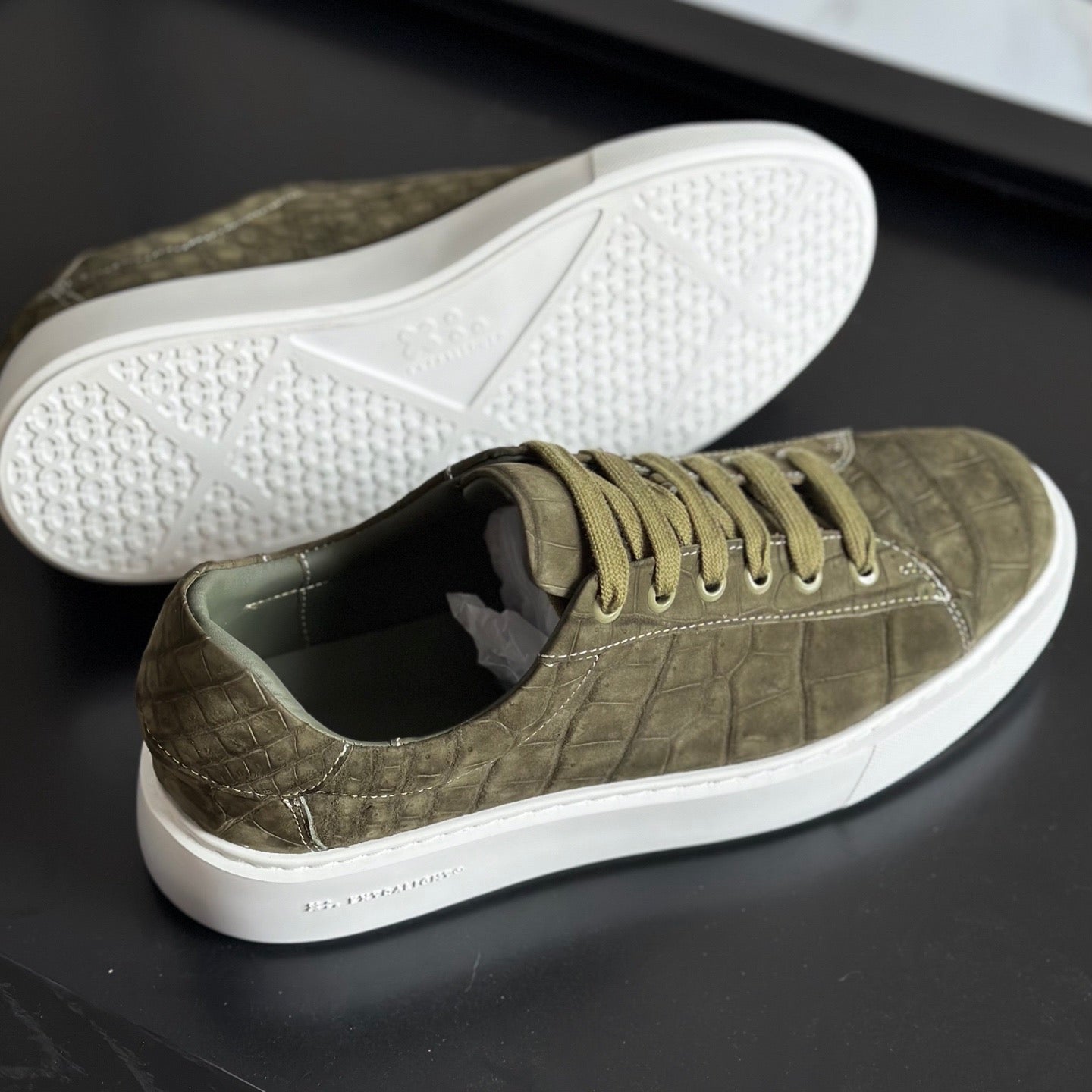 Green Rossie Viren crocodile sneakers made from genuine nubuck crocodile leather, showcasing stylish, high-quality shoes.
