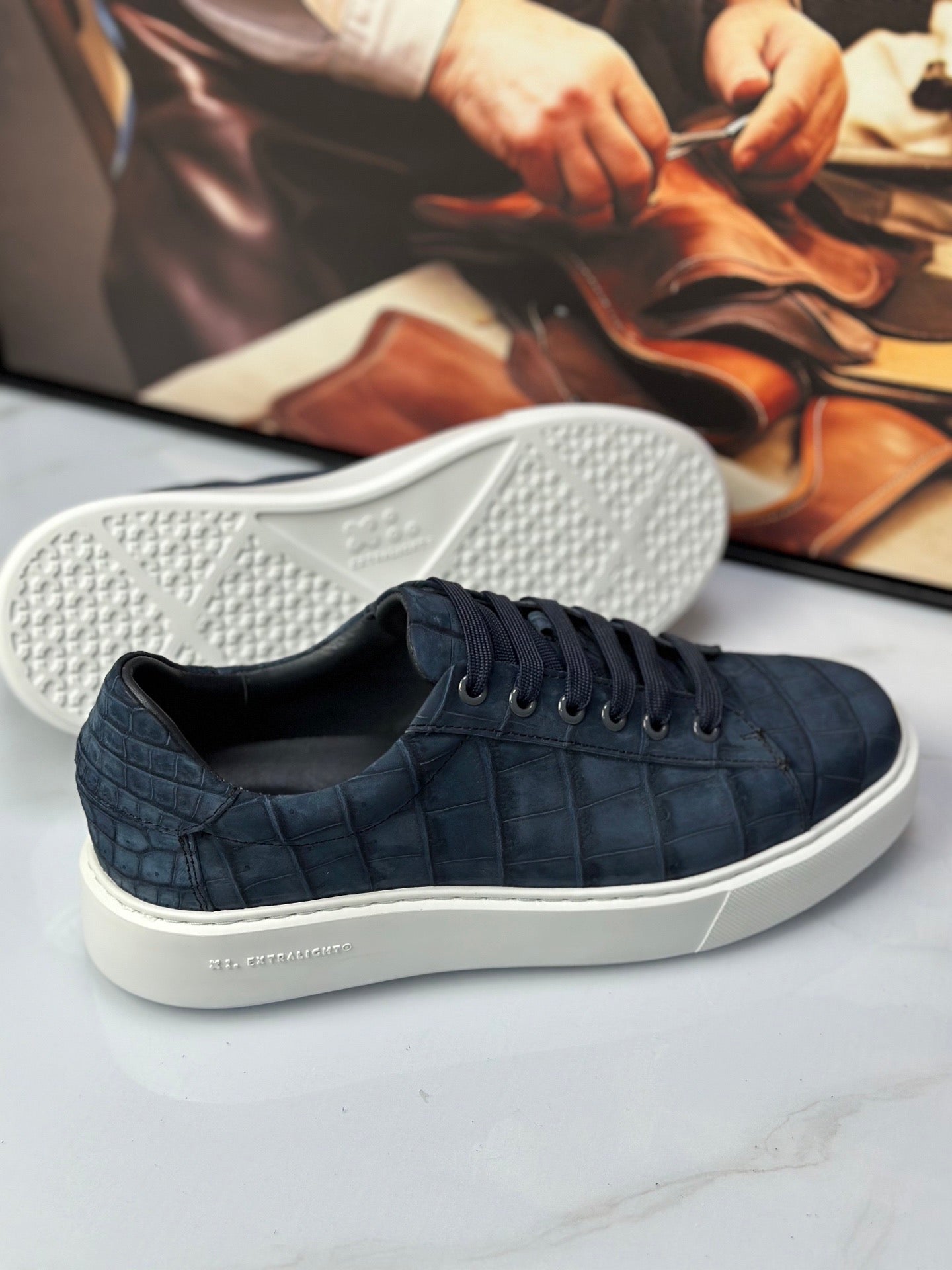 Dark blue Rossie Viren crocodile sneakers made from genuine nubuck crocodile leather, showcasing stylish shoe design.