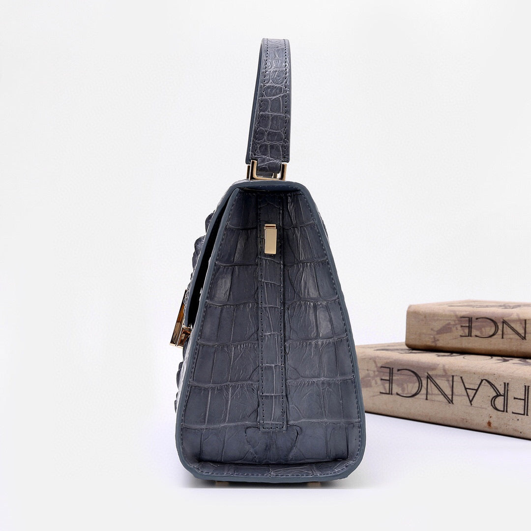 Genuine grey crocodile skin bone leather top handle bag by Rossie Viren, featuring a sleek design and sturdy top handle.