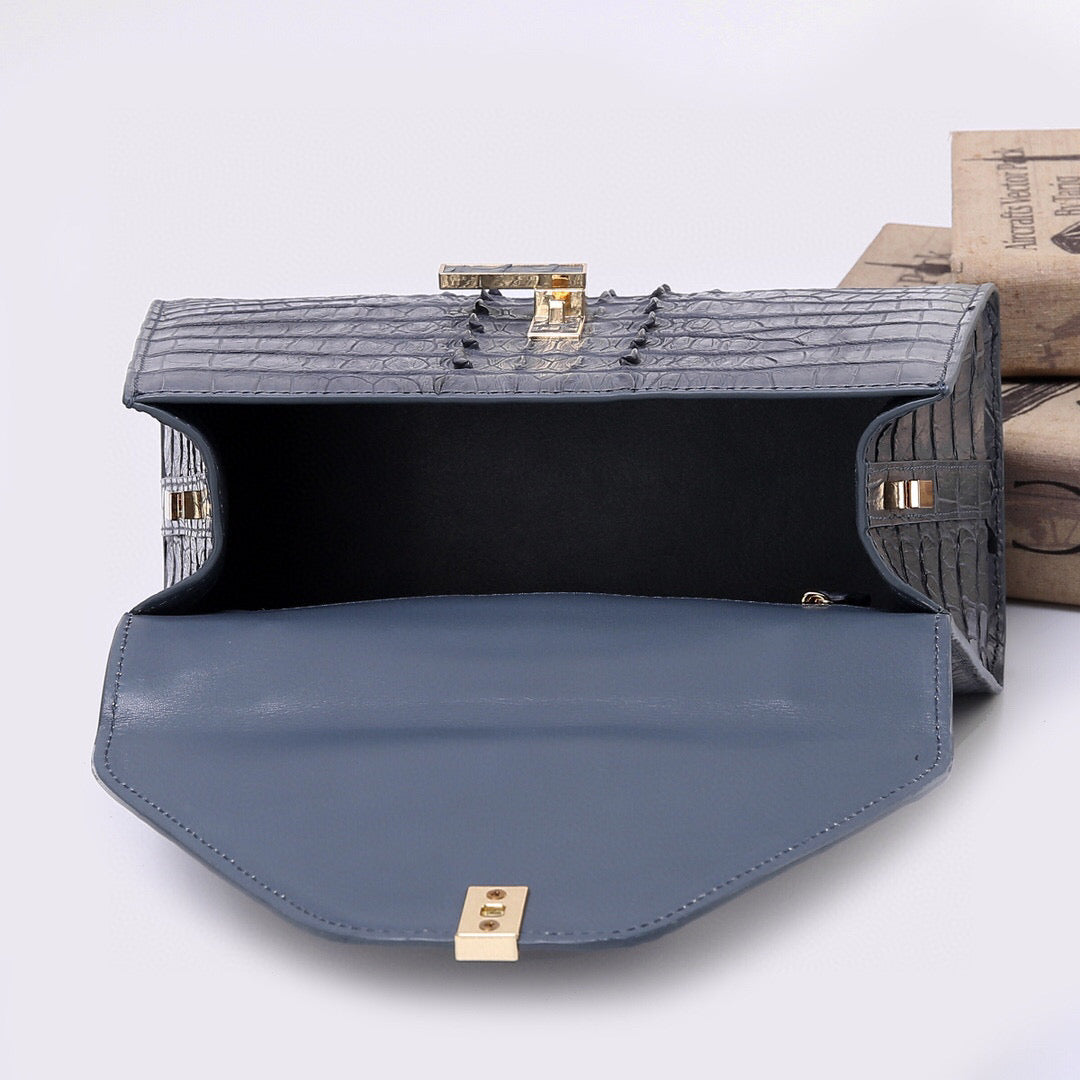 Genuine crocodile skin bone leather top handle bag in grey by Rossie Viren, featuring a sleek, structured design with a top handle.