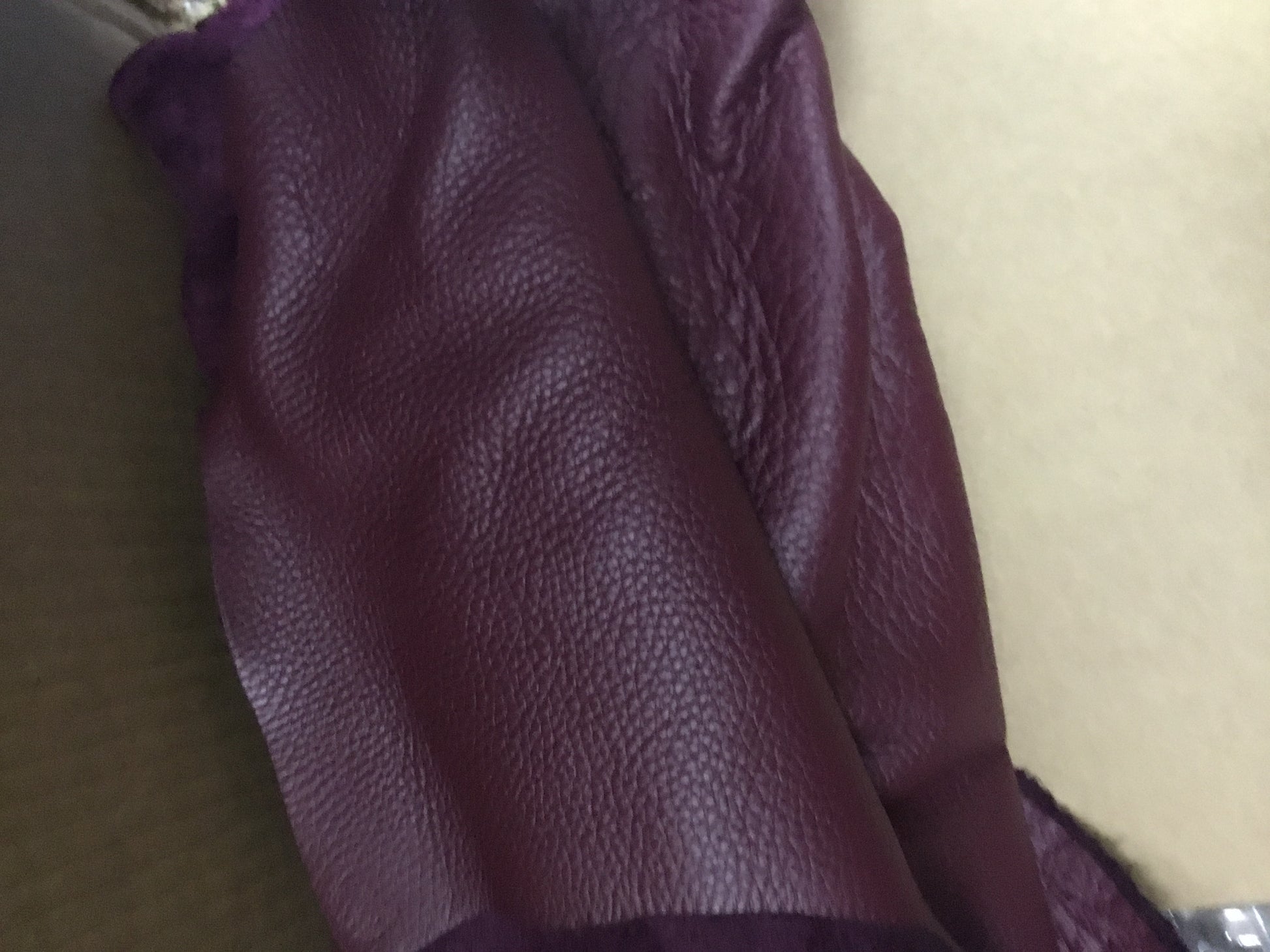 Rossie Viren wine red calfskin leather handbag with large size, sturdy handle, and a padlock for business travel and office use.