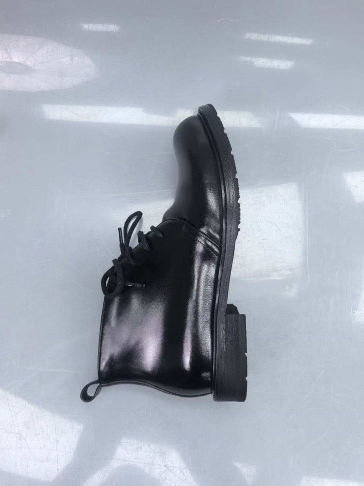 Genuine shell cordovan leather short lace-up Martin boots by Rossie Viren, featuring a sleek leather finish and sturdy design.
