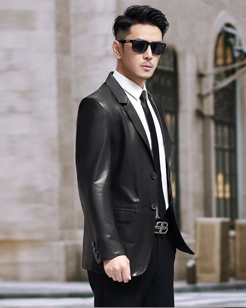 Black leather blazer jacket by Rossie Viren, tailored fit with lapels and button closure, stylish and versatile for professional or casual wear.