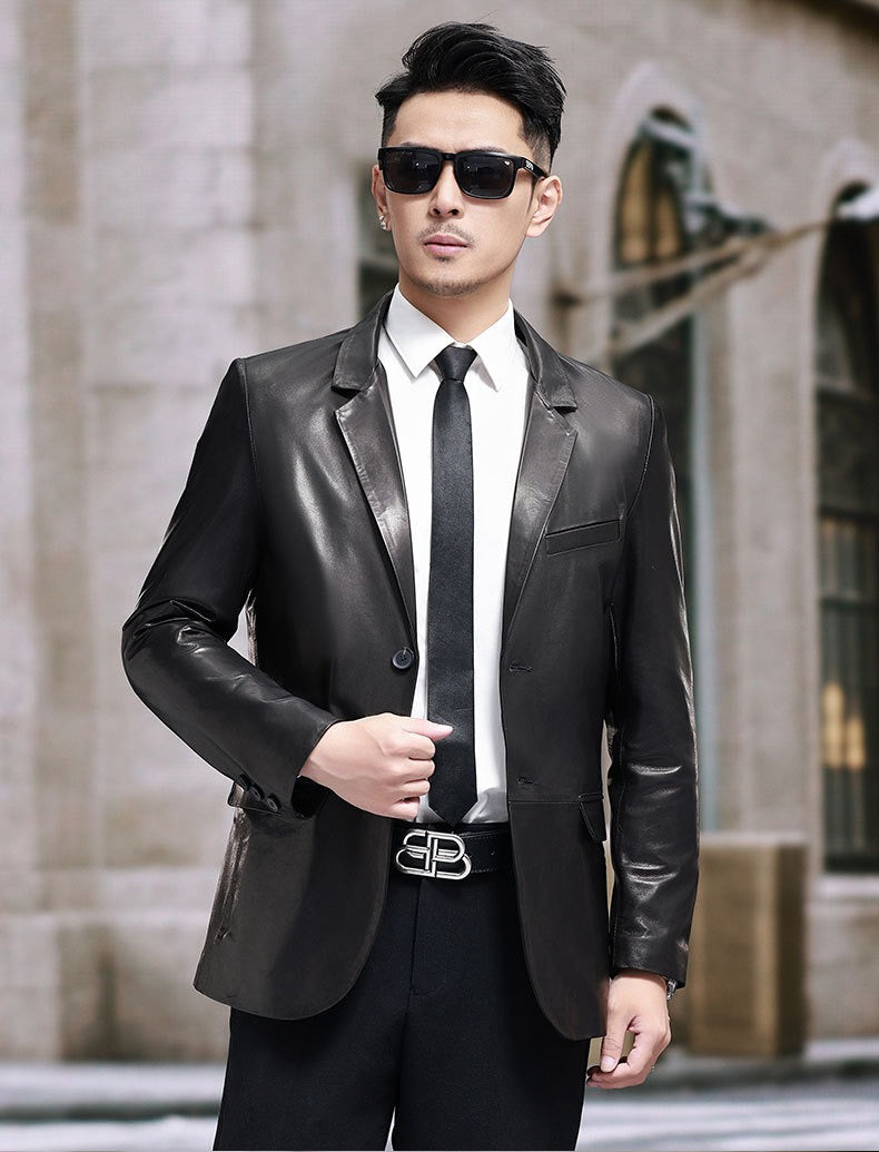 Black leather blazer jacket by Rossie Viren, featuring a tailored fit and classic lapel design, displayed on a hanger.