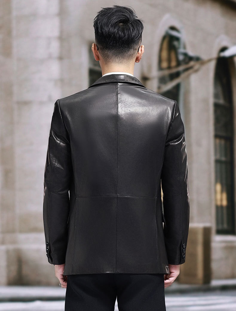 Black leather blazer jacket by Rossie Viren, featuring a tailored fit and classic lapel, shown on a hanger.
