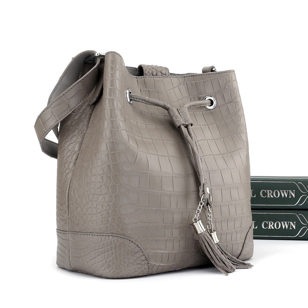 Unisex crocodile leather drawstring bucket shoulder bag with crossbody strap, large capacity, by Rossie Viren.