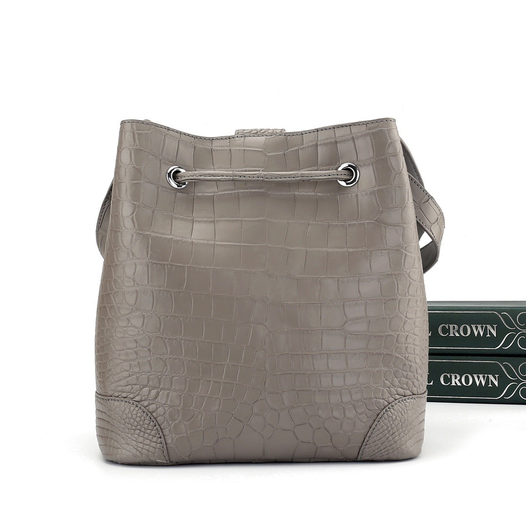 Unisex crocodile leather drawstring bucket shoulder bag with crossbody strap, large capacity, by Rossie Viren.