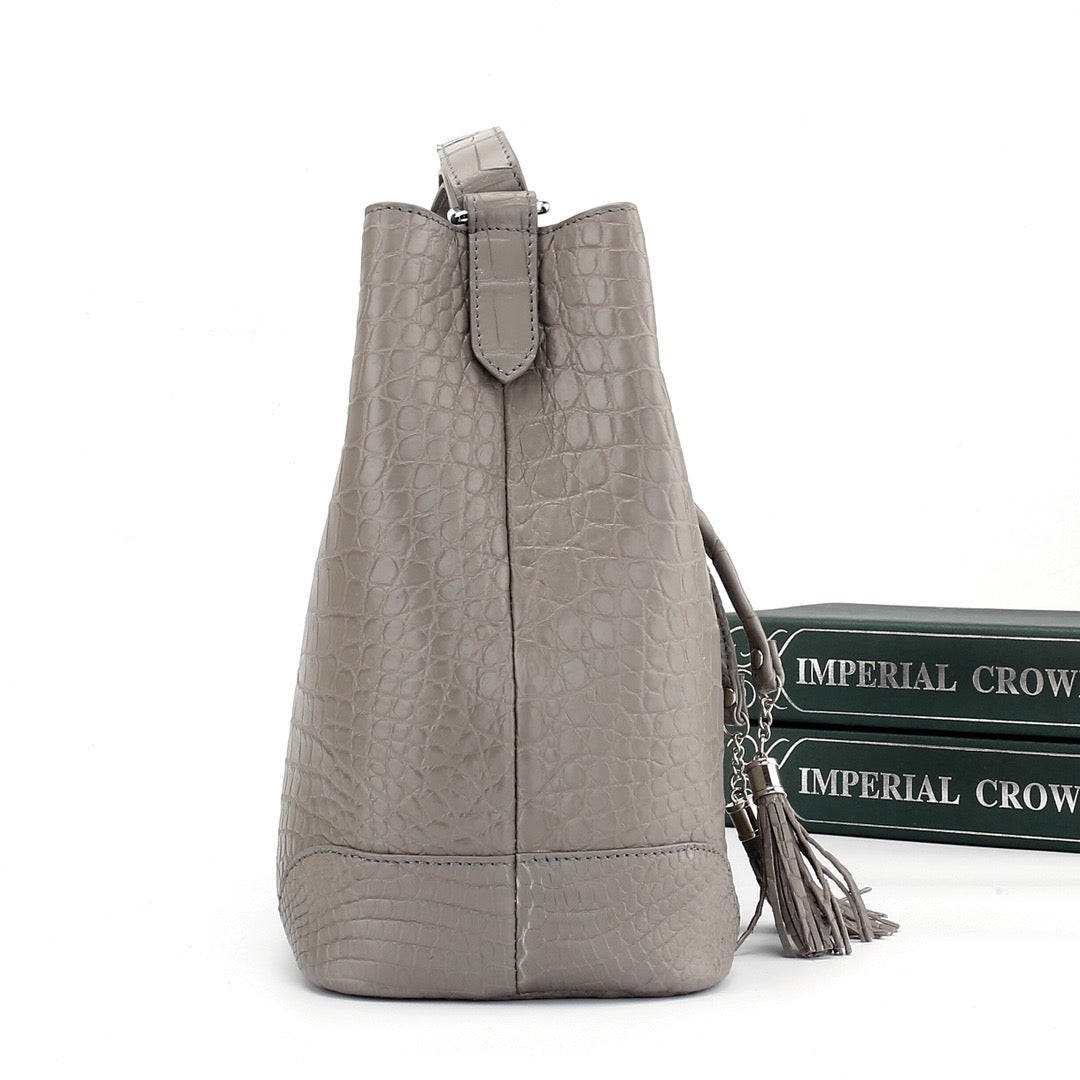 Unisex crocodile leather drawstring bucket shoulder bag with crossbody strap, large capacity, Rossie Viren handbag in black.