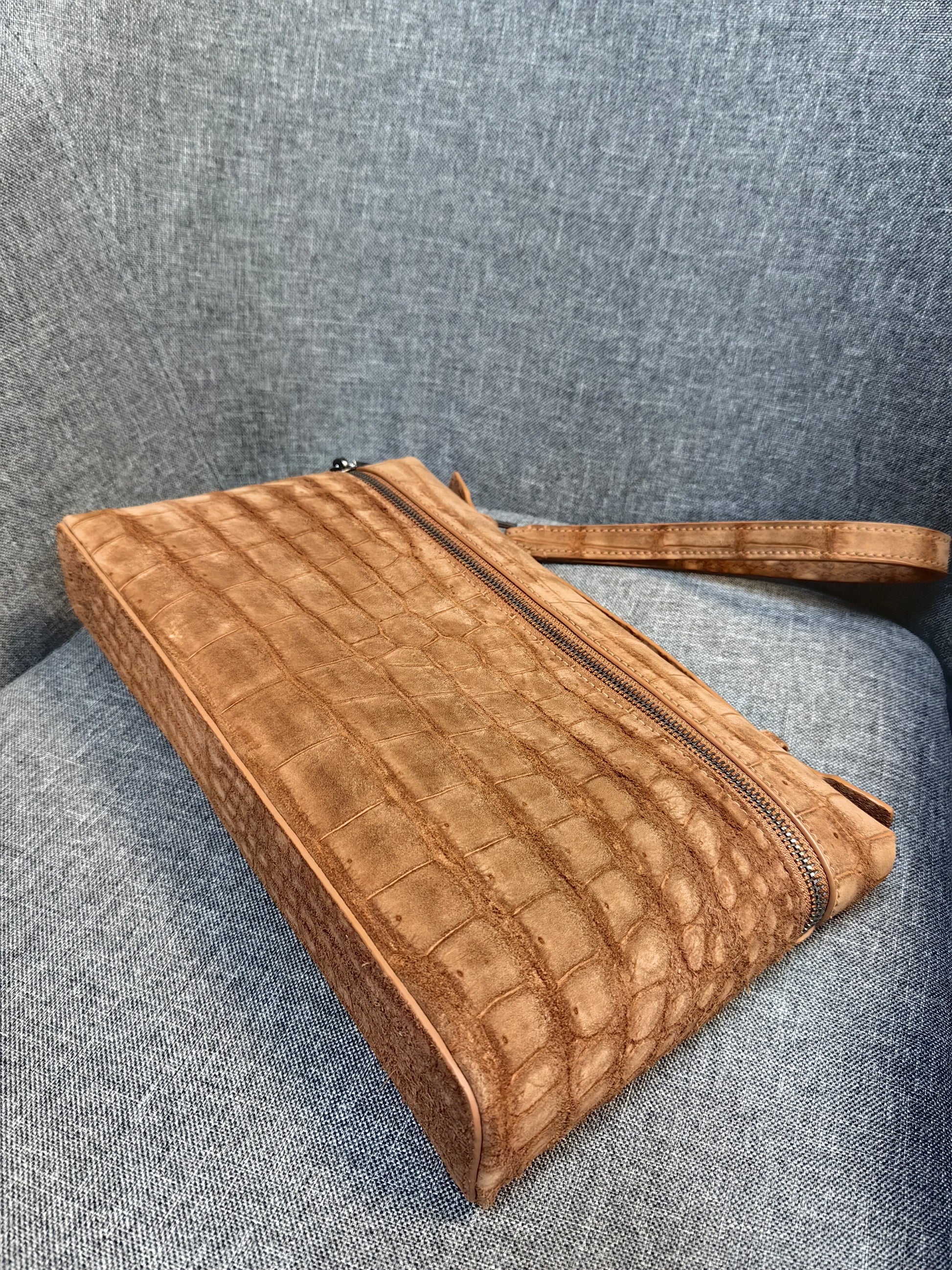 Unisex Rossie Viren crocodile skin leather clutch bag with zipper handle, made from nubuck genuine crocodile leather.