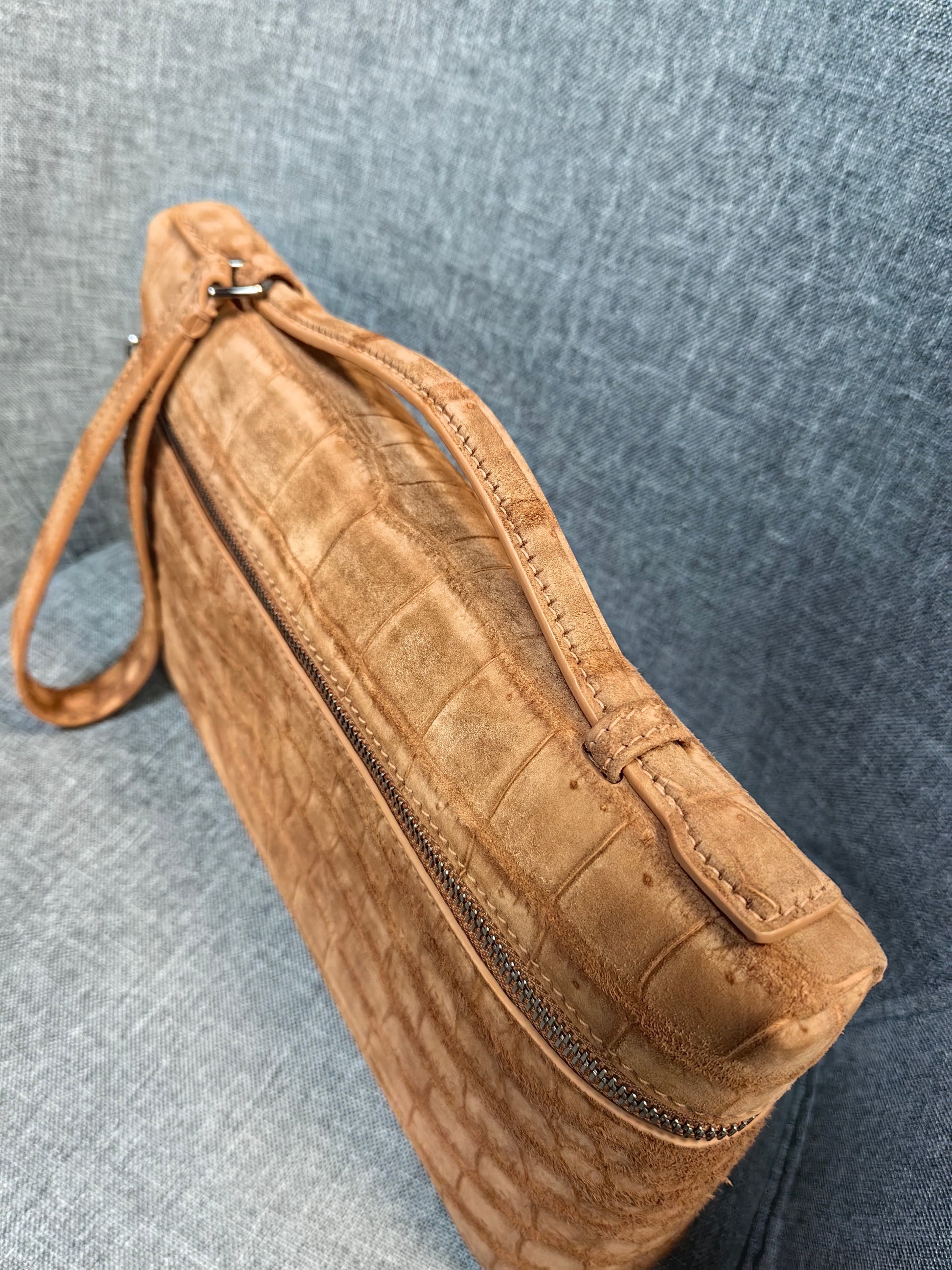 Unisex Rossie Viren crocodile leather clutch bag with zipper handle, made from genuine nubuck crocodile skin for a stylish look.