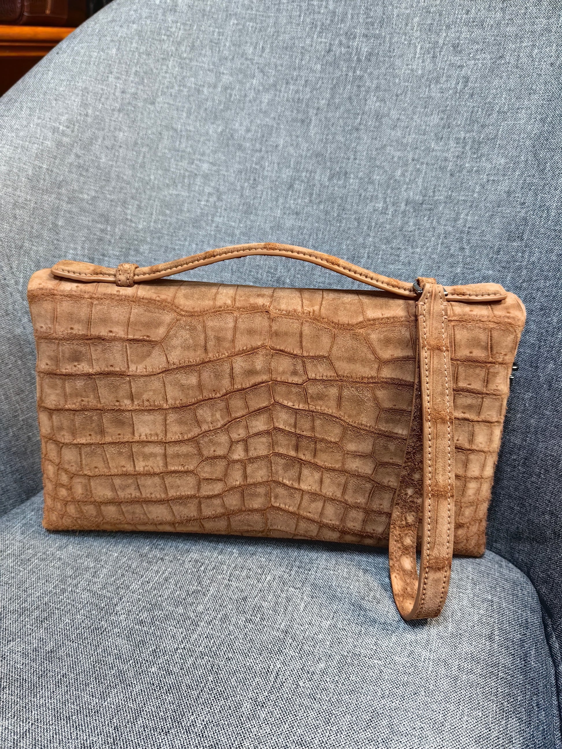 Unisex Rossie Viren crocodile leather clutch bag with zipper handle, nubuck finish, stylish and compact for everyday use.