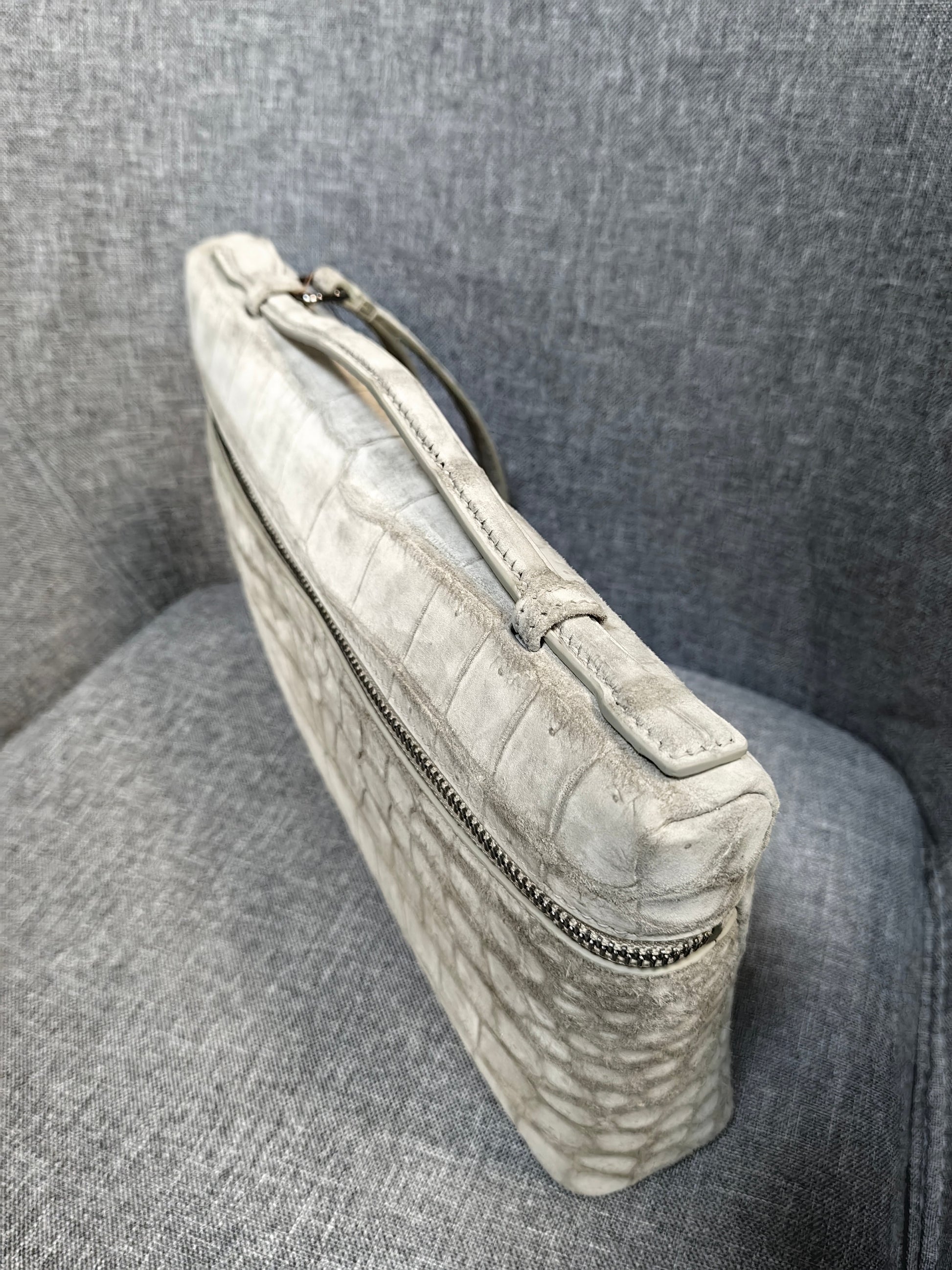 Unisex Rossie Viren clutch bag with genuine crocodile skin leather, nubuck finish, zipper handle, stylish handbag accessory.