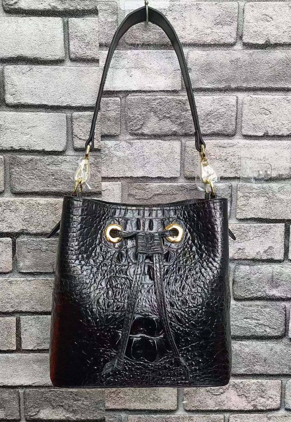 Crocodile leather Rossie Viren handbag with bucket shape, featuring a drawstring closure and stylish design.